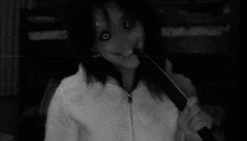 Scary jumpscare girl holding a knife